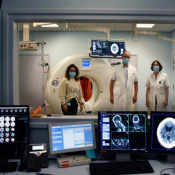 physicians stood by CT scanner